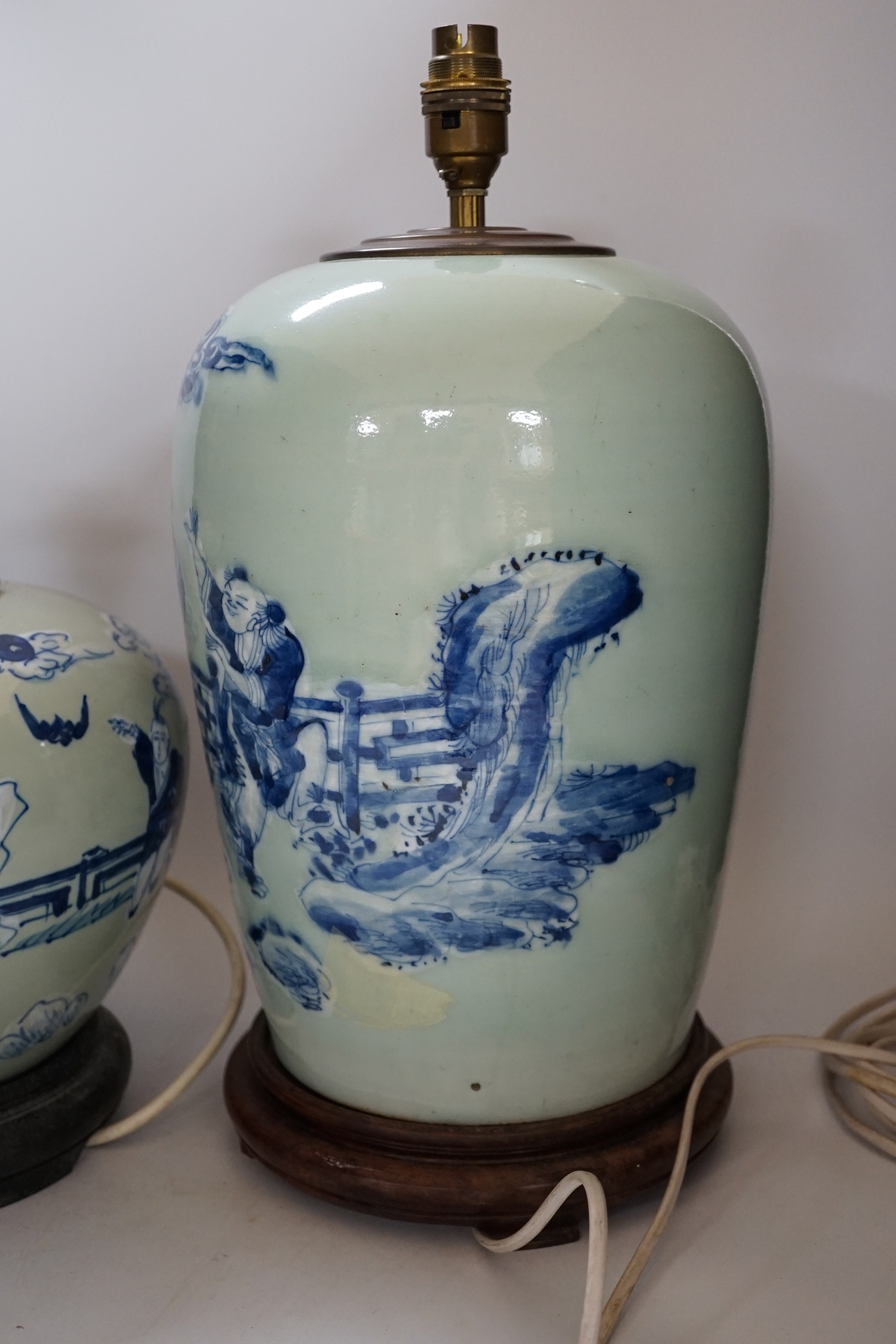 Two Chinese blue and white celadon glazed lamp bases, largest 43cm high including fitting